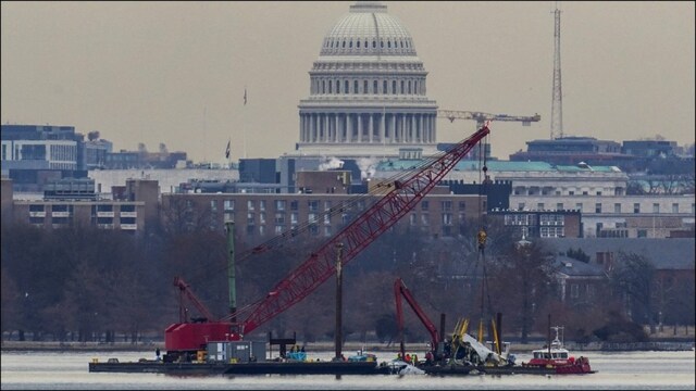  Salvage crews recovering the wreckage of the American Airlines plane from the Potomac. (Reuters)