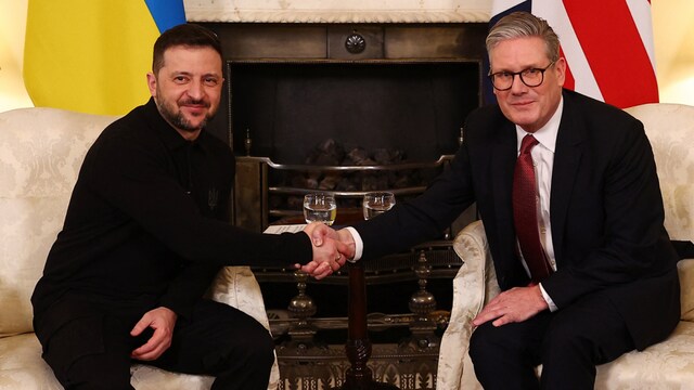 Britain's Prime Minister Keir Starmer shakes hands with Ukraine's President Volodymyr Zelensky during a bilateral meeting in central London (AFP)