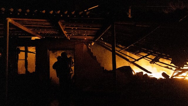 Firefighters extinguish a fire on a damaged building following a strike in Kramatorsk, Donetsk region on March 11, 2025, amid the Russian invasion of Ukraine. (Photo by Tetiana DZHAFAROVA / AFP)