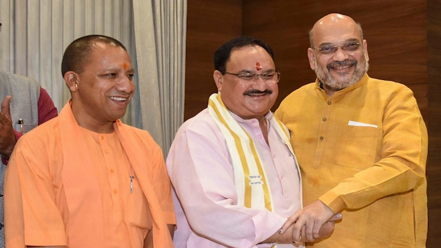 UP CM Yogi Adityanath, BJP President JP Nadda and Union Home Minister Amit Shah. (PTI Photo)