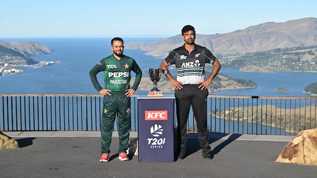 Salman Agha (left) and Ish Sodhi pose with the T20I trophy. (AFP Photo)