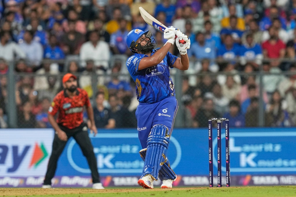 Rohit Sharma smashed three maximums in his 16-ball 26 before falling to Cummins (AP) Rohit Sharma smashed three maximums in his 16-ball 26 before falling to Cummins (AP)