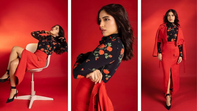 Set against a vivid red backdrop, the entire frame transforms into a monochrome fantasy where Bhumi simultaneously blends into and commands the scene