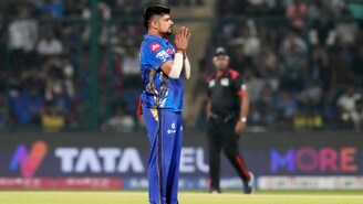 Karn Sharma celebrates a wicket against Delhi Capitals. (AP Photo)