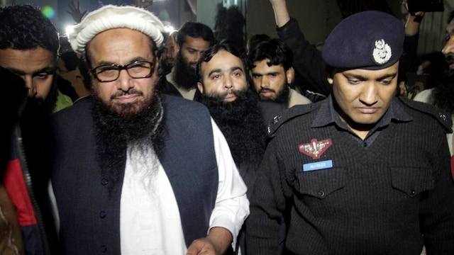 Even from custody, Hafiz Saeed continues to orchestrate operations with security provided by the ISI. (PTI)
