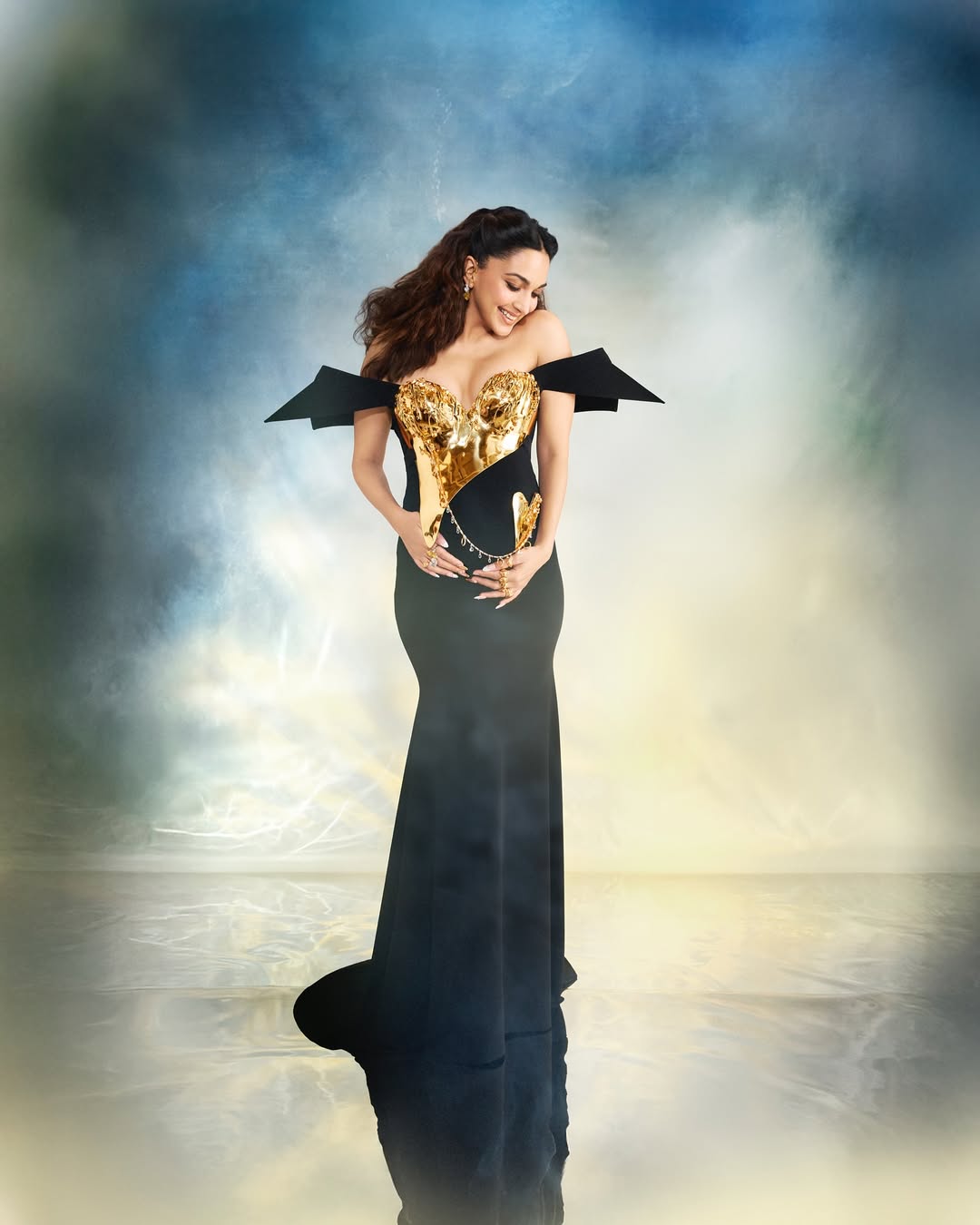Her gown also resonated with two symbolic forms: Mother Heart and Baby Heart and were linked by a chain umbilical cord, visually narrating the beautiful bond of motherhood. (Image: Instagram) Her gown also resonated with two symbolic forms: Mother Heart and Baby Heart and were linked by a chain umbilical cord, visually narrating the beautiful bond of motherhood. (Image: Instagram)
