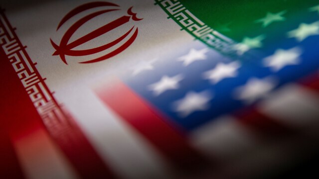 Iran's and U.S.' flags are seen printed on paper in this illustration. (Representative image)