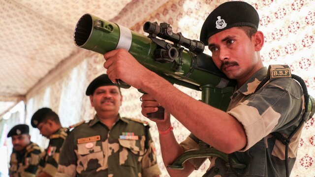 Border Security Force (BSF) unit   show  weapons during an accumulation  organised arsenic  portion  of their preparedness, astatine  BSF Camp (PTI)
