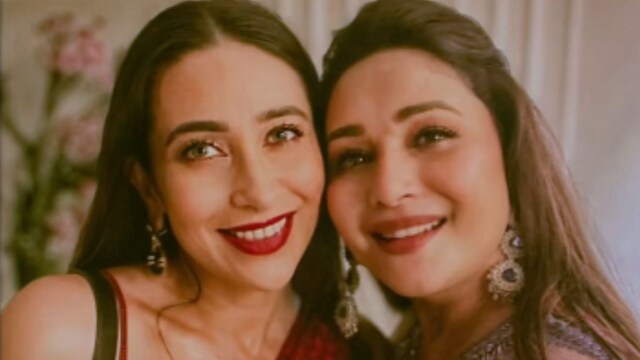 Karisma Kapoor and Madhuri Dixit stock  a adjacent  bond.