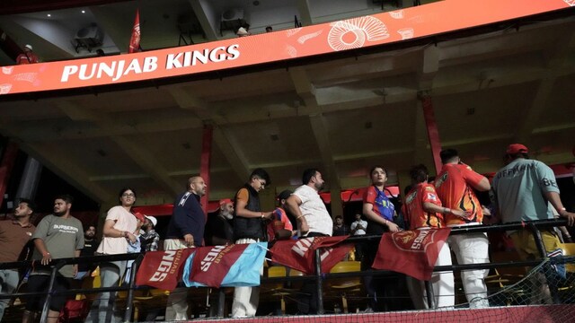 Spectators leave the stands after the authorities asked to evacuate the stadium (Picture credit: AP)
