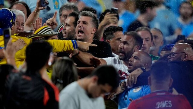 Uruguay players getting into a tussle with the Colombia fans (X)