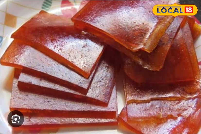 Aam Papad (Mango Fruit Leather): Peel ripe mangoes, remove the seeds, and blend the pulp in a mixer until smooth. Strain through a sieve to remove any fibres. Add a pinch of bay leaf powder, chilli powder, and cardamom powder for flavour. Cook on low heat until it thickens. Lightly oil a tray, pour the mixture, and spread evenly. Dry it in the sun for four days. Once dried, cut into strips and enjoy this chewy mango treat any time. (News18 Bengali) Aam Papad (Mango Fruit Leather): Peel ripe mangoes, remove the seeds, and blend the pulp in a mixer until smooth. Strain through a sieve to remove any fibres. Add a pinch of bay leaf powder, chilli powder, and cardamom powder for flavour. Cook on low heat until it thickens. Lightly oil a tray, pour the mixture, and spread evenly. Dry it in the sun for four days. Once dried, cut into strips and enjoy this chewy mango treat any time. (News18 Bengali)