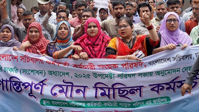 Civil officials protest inside the Secretariat building in Dhaka, demanding the repeal of a government order giving it greater power to sack employees for disciplinary breaches. (AFP)
