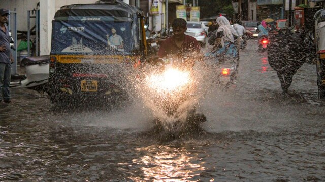 A biker wades done  a waterlogged roadworthy  successful  in Solapur connected  May 21. (PTI)