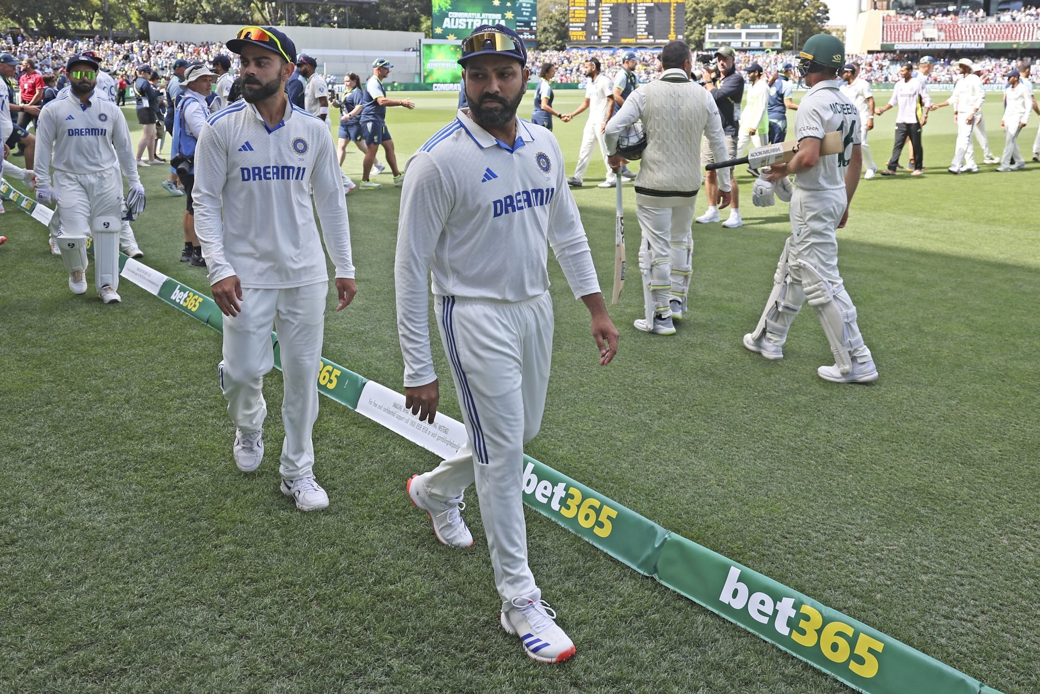 India's captain Rohit Sharma, right, and teammate Virat Kohli leave the field with others after their loss in the second cricket test match against Australia at the Adelaide Oval in Adelaide, Australia, Sunday India's captain Rohit Sharma, right, and teammate Virat Kohli leave the field with others after their loss in the second cricket test match against Australia at the Adelaide Oval in Adelaide, Australia, Sunday