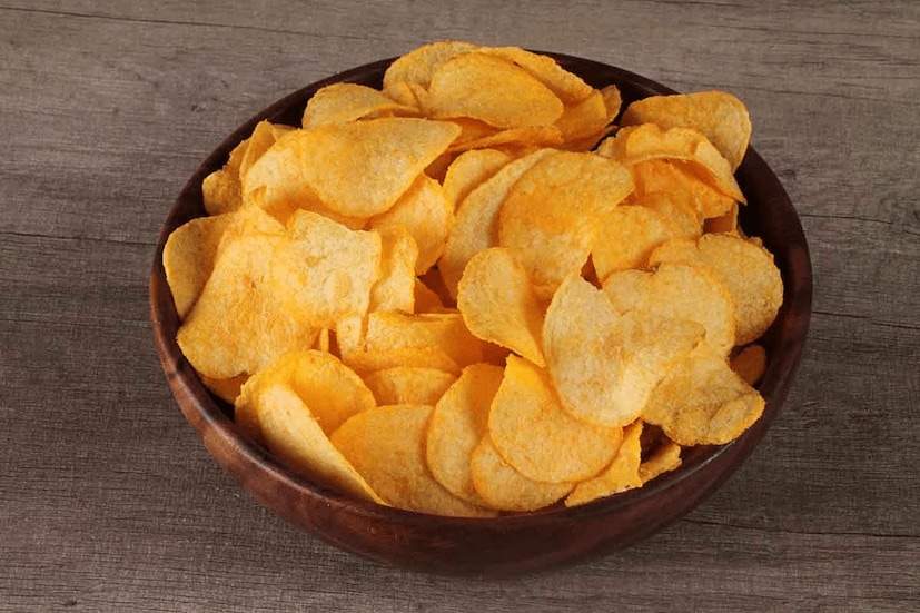 Potato Chips: In 1853, George Crum was trying to calm a customer in his restaurant. He sliced potatoes thinly and fried them until crispy, unintentionally creating the popular snack of potato chips. Crum’s accidental invention has since become extremely popular worldwide. (News18 Tamil) Potato Chips: In 1853, George Crum was trying to calm a customer in his restaurant. He sliced potatoes thinly and fried them until crispy, unintentionally creating the popular snack of potato chips. Crum’s accidental invention has since become extremely popular worldwide. (News18 Tamil)