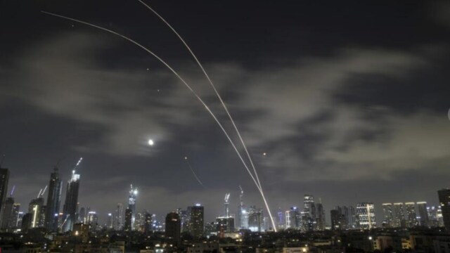 The Israeli Iron Dome air defense system fires to intercept missiles during an Iranian attack over Tel Aviv, Israel, early Wednesday, June 18, 2025. (AP Photo)