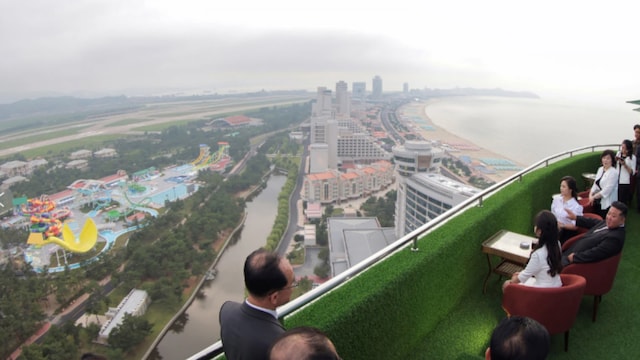 Kim donned a dark suit and tie as he hailed the resort as one of North Korea’s “greatest feats” of the year. (AP photo)
