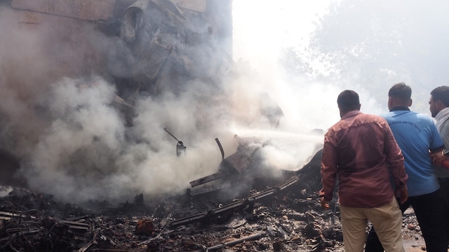 Firefighters work at the site where Air India flight 171 crashed in a residential area near the airport in Ahmedabad on June 12, 2025. (AFP photo)
