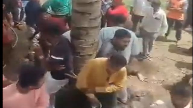Villagers surround the activists and assault them. (Screengrab from video from X)