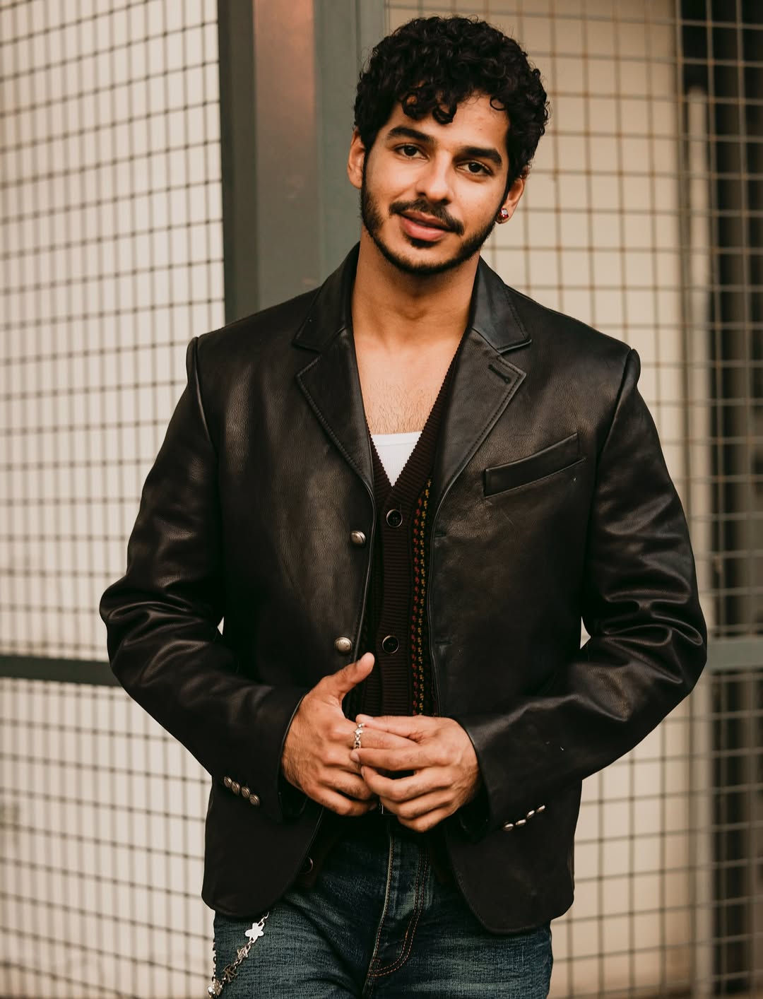 Bollywood actor Ishaan Khatter looked suave in a black leather jacket, which he left open to give a peek into a brown sweater. (Image: Instagram) Bollywood actor Ishaan Khatter looked suave in a black leather jacket, which he left open to give a peek into a brown sweater. (Image: Instagram)