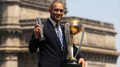 MS Dhoni poses for photo with ODI World Cup 2011 trophy. (Picture Credit: AFP)