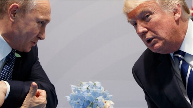 A file photo of Vladimir Putin with Donald Trump (AP)