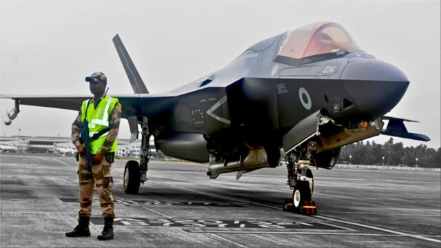 CISF personnel stand guard near the British F-35 fighter jet that made an emergency landing after running low on fuel in Thiruvananthapuram (PTI photo)