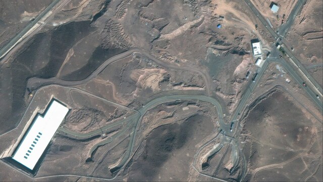 Satellite image courtesy of Maxar Technologies shows cargo trucks postioned near an underground entrance to Iran's Fordo Fuel Enrichment Plant (AFP)
