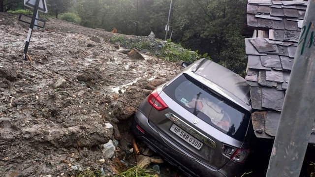A damaged vehicle after being swept away in flash floods due to cloudbursts, in Kullu  (PTI)
