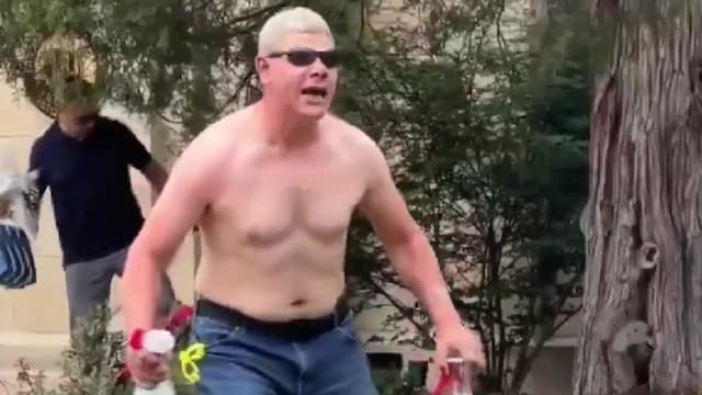 Video showed shirtless Soliman holding bottles in his hands (X)