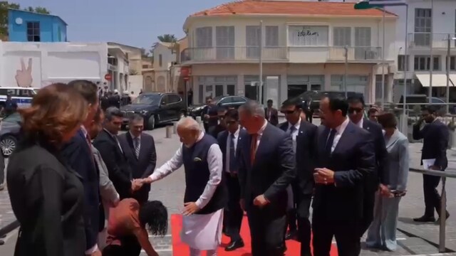 Michaela Kythreoti Mhlapa, Member of Council of Nicosia, while welcoming PM Modi at the historic Centre of Nicosia, touched PM Modi's feet  (X)