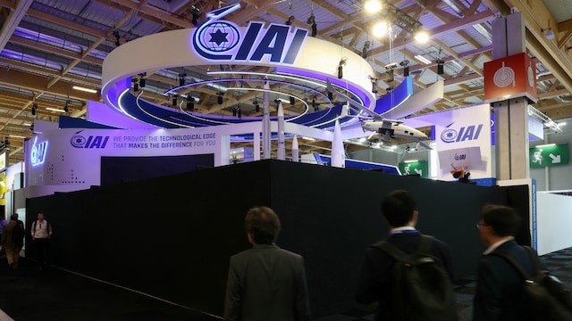 Attendees walk past the closed Israel Aerospace Industries (IAI) Israeli Pavillon during the 55th edition of the  Paris Air Show at the Paris–Le Bourget Airport. (AFP)