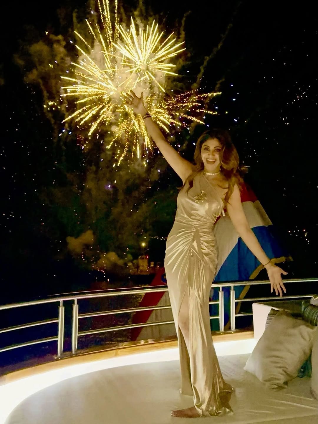 She exudes happiness and glitz as she poses on a yacht while fireworks illuminate the night sky in the background. (Image: Instagram) She exudes happiness and glitz as she poses on a yacht while fireworks illuminate the night sky in the background. (Image: Instagram)