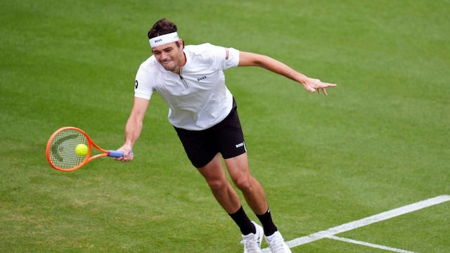 Taylor Fritz returns the ball during his match against Joao Fonseca on day four of the Eastbourne Open at Devonshire Park Lawn Tennis Club, Eastbourne, England, Thursday June 26, 2025. (John Walton/PA via AP)


