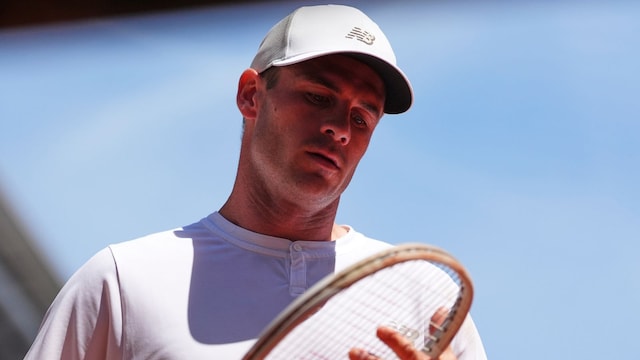 Tommy Paul of the U.S. checks his racket as he plays Australia's Alexei Popyrin during their fourth round match of the French Tennis Open, at the Roland-Garros stadium, in Paris, Sunday, June 1 2025. (AP Photo/Lindsey Wasson)


