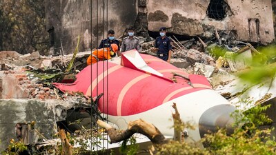 Wreckage of the crashed Air India plane being lifted through a crane in Ahmedabad. (PTI)
