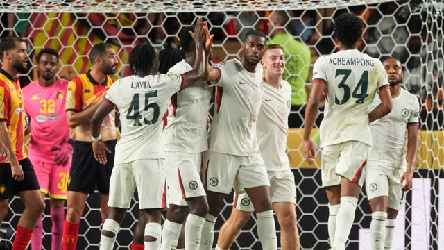Tosin Adarabioyo, (center) celebrates with Chelsea teammates after scoring his side's opening goal. (AP Photo)
