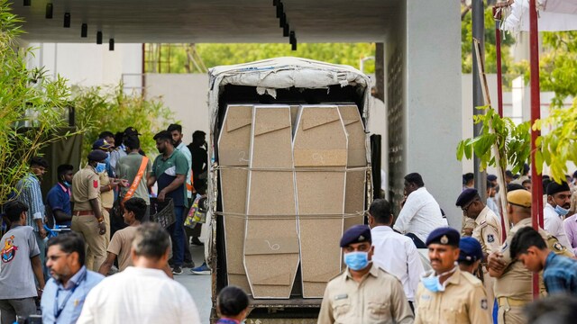 Empty coffins brought at the mortuary of the Civil Hospital in Ahmedabad for victims of Air India crash. (PTI)