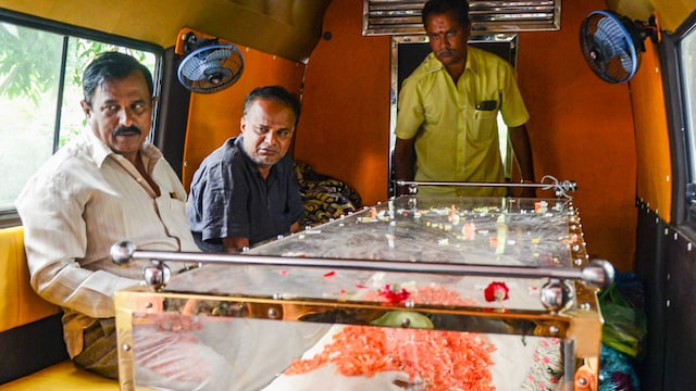 Bereaved father, in black, of Divyanshi, a victim of the stampede near the Chinnaswamy Cricket Stadium, in Bengaluru, Karnataka. (PTI photo)