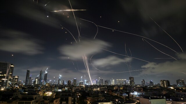 The Israeli Iron Dome air defense system fires to intercept missiles during an Iranian attack over Tel Aviv, Israel, early Wednesday, June 18, 2025. (AP Photo)