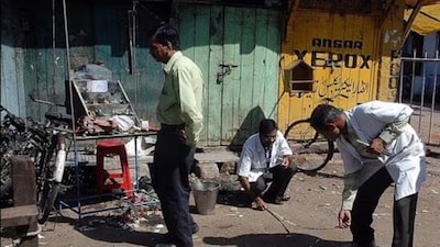 Forensic experts search for clues at the blast site in Malegaon in 2008. File pic