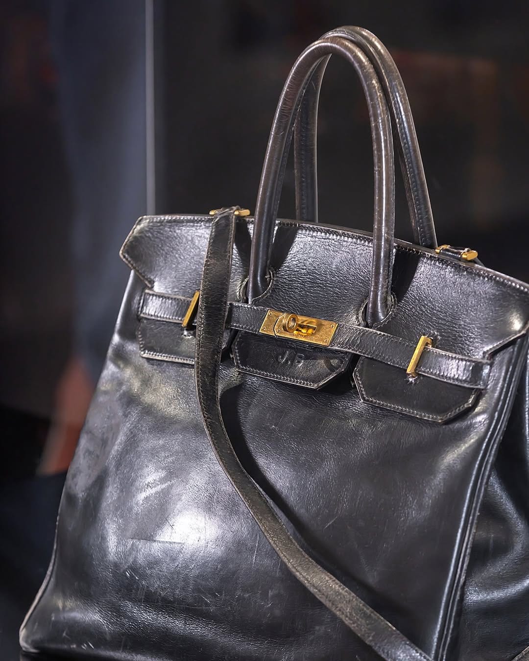 The first-ever Birkin bag is saddle-stitched and comes in a jet black shade. It is made entirely of leather and consists of gold hardware, contributing to its extra dose of regal charm. (Image: Instagram)