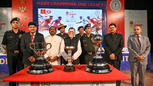Lt. Gen Mohit Malhotra, AVSM SM, Chief of Staff, Eastern Command; D B Sundara Ramam, Vice President Corporate Services, Tata Steel Limited; Ramdas Soren, Hon'ble Minister of School Education & Literacy Development, Government of Jharkhand;  Santosh Kumar Gangwar, Hon'ble Governor of Jharkhand; Major Gen. Paramvir Singh Dagar, VSM, General Officer Commanding, Cockerel Division; Shri Shekhar Jamuar IAS, Director Sports, Department of Tourism, Arts, Culture, Sports & Youth Affairs, Government of Jharkhand; Shri Karn Satyarthi IAS, District Collector, East Singhbhum with the three Durand trophies. 