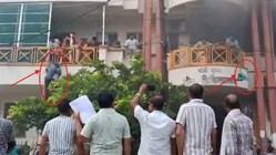 Massive fire triggers chaos at Hardoi hospital, families seen using ladders for escape. (IMAGE: PTI)