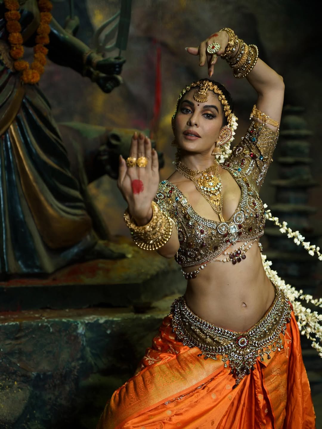 She donned a traditional classical dance costume, featuring an embellished golden blouse adorned with gemstones and a silk saree with a pleated fan in the front that unfolded gracefully with every leg movement. (Image: Instagram)