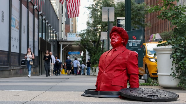 A bright red sculpture of US President Donald Trump emerged from a manhole on East 42nd Street in Midtown Manhattan. (Reuters)
