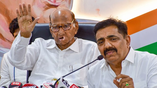 NCP (Sharadchandra Pawar) chief Sharad Pawar with party leader Jayant Patil. (PTI file photo)