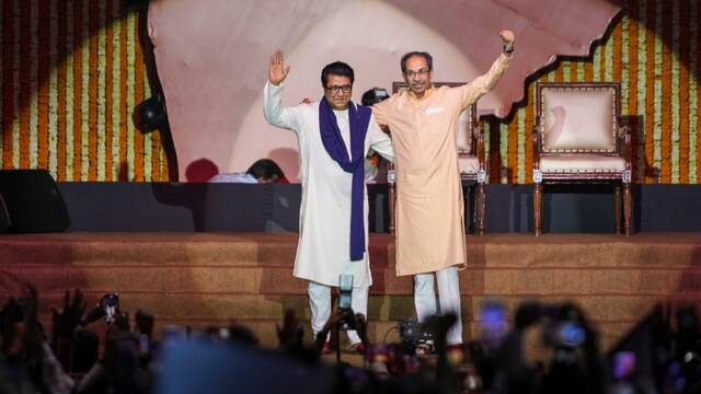 MNS chief Raj Thackeray, left, and Shiv Sena (UBT) chief Uddhav Thackeray during a joint victory rally organised by the cousins, at Worli area, in Mumbai, Maharashtra. (PTI Photo)