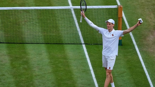 Italy's Jannik Sinner celebrates after beating Carlos Alcaraz of Spain to win the men's singles final at the Wimbledon Tennis Championships in London, Sunday, July 13, 2025.(AP Photo/Joanna Chan)
